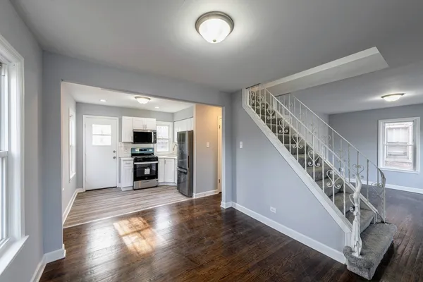 a view of a livingroom with wooden floor