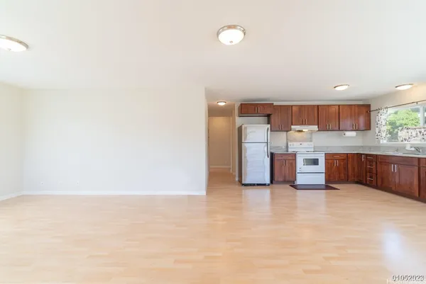 a kitchen with stainless steel appliances a refrigerator and a sink