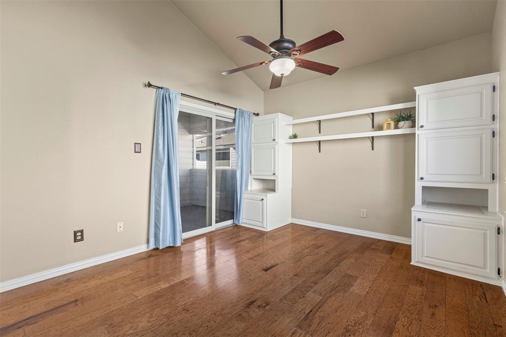 17490 Meandering Way, Unit 404 Dallas, TX 75252 - Photo 15 of 25 an empty room with wooden floor closet and windows