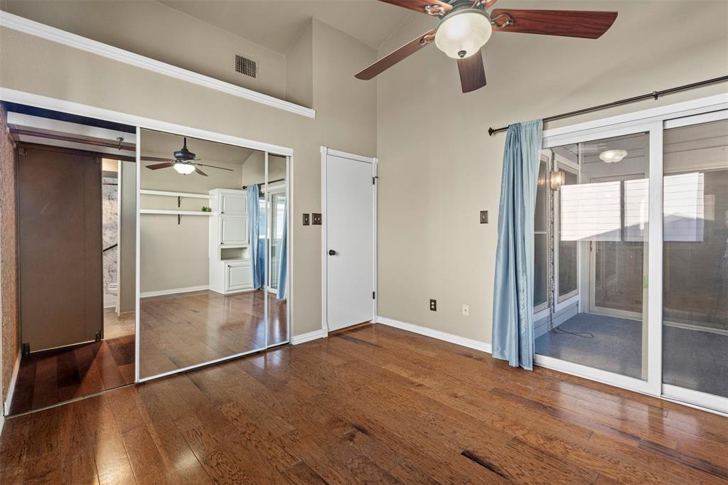 17490 Meandering Way, Unit 404 Dallas, TX 75252 - Photo 16 of 25 a view of empty room with wooden floor and fan