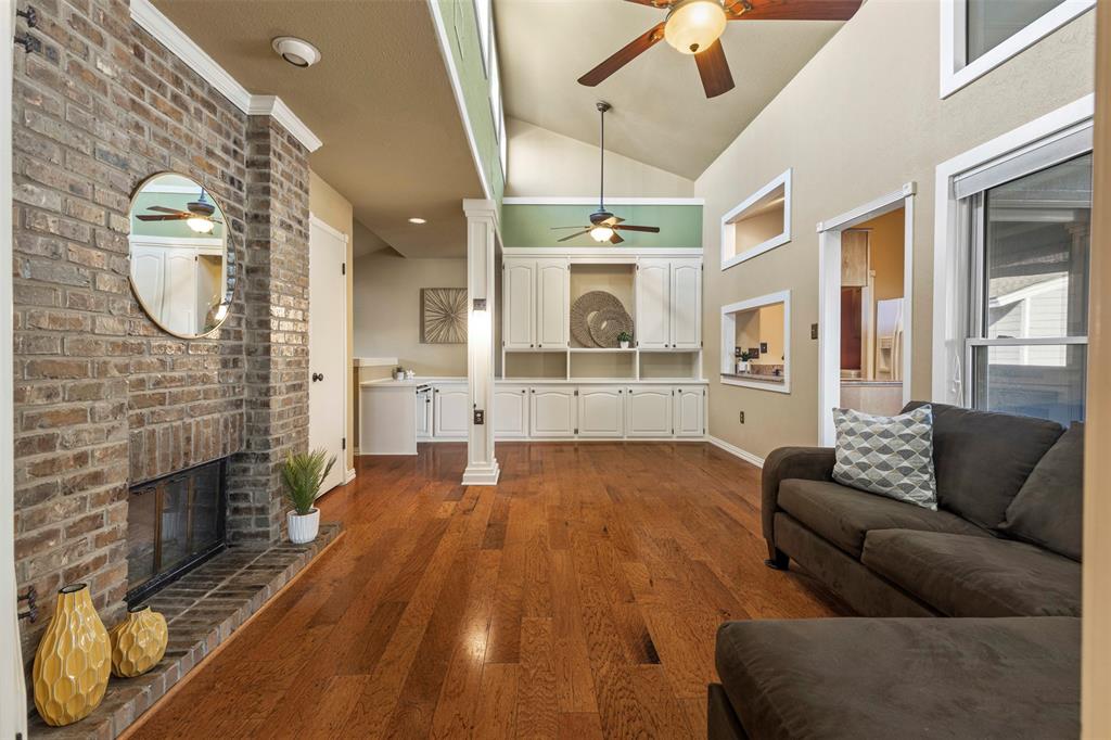 17490 Meandering Way, Unit 404 Dallas, TX 75252 - Photo 5 of 25 a living room with furniture and a fireplace