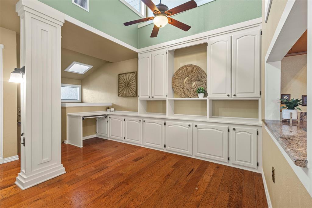 17490 Meandering Way, Unit 404 Dallas, TX 75252 - Photo 7 of 25 a kitchen with a sink cabinets and window