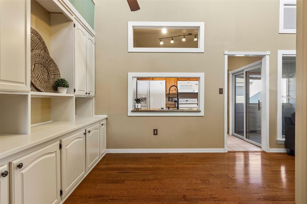 17490 Meandering Way, Unit 404 Dallas, TX 75252 - Photo 8 of 25 a view of a hallway with wooden floor and entryway