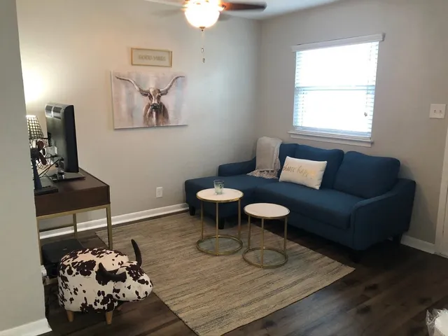 a living room with furniture and a table