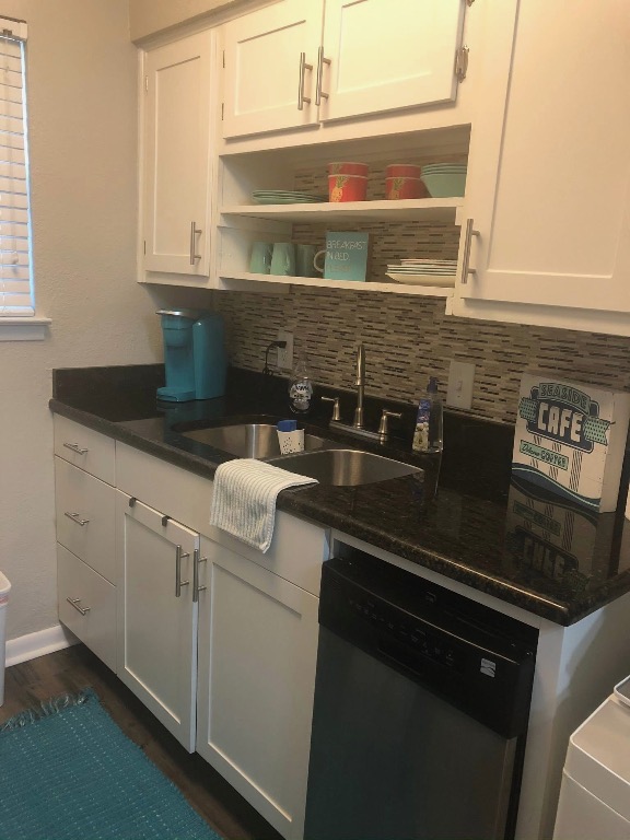 2401 Manor Road, Unit 117 Austin, TX 78722 - Photo 3 of 7 a kitchen with granite countertop white cabinets and white appliances