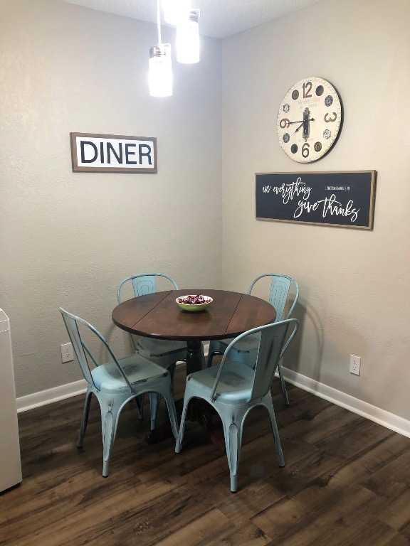 2401 Manor Road, Unit 117 Austin, TX 78722 - Photo 6 of 7 a view of a table and chairs