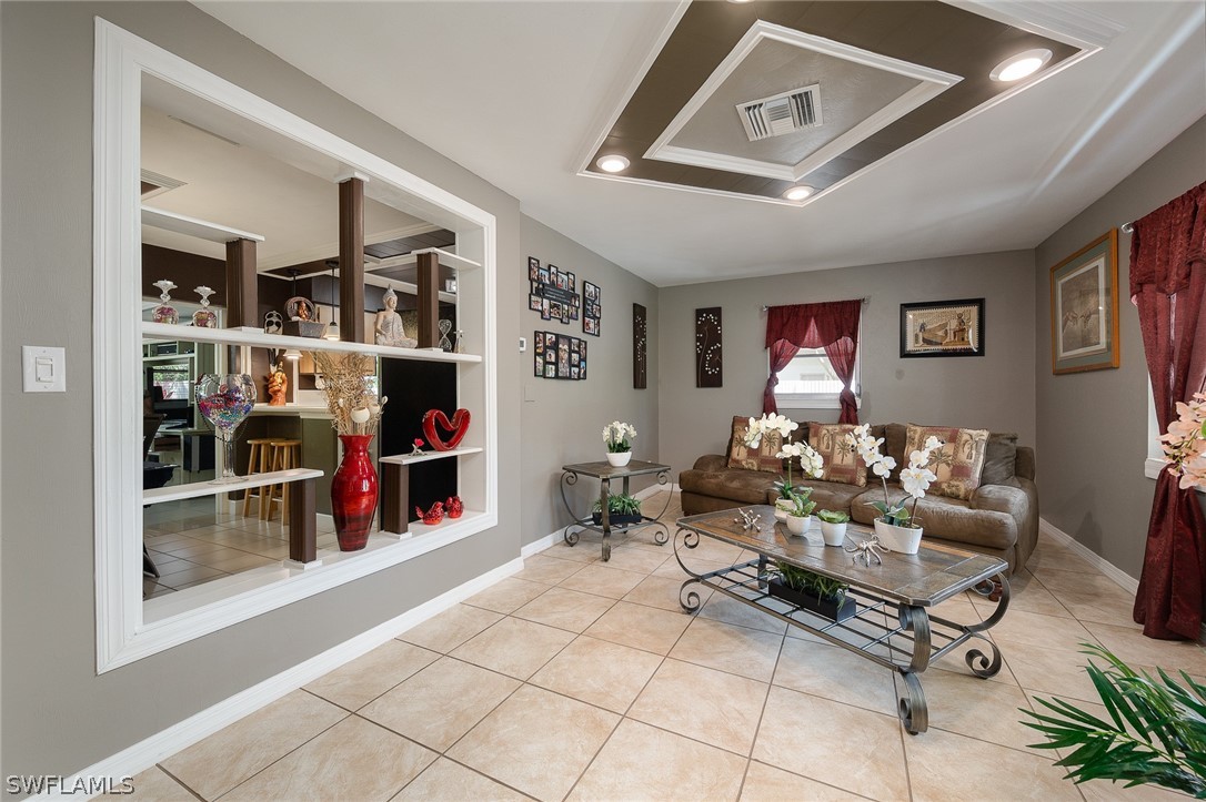 2205 Caladium Road Fort Myers, FL 33905 - Photo 5 of 19 a living room with lots of furniture and window