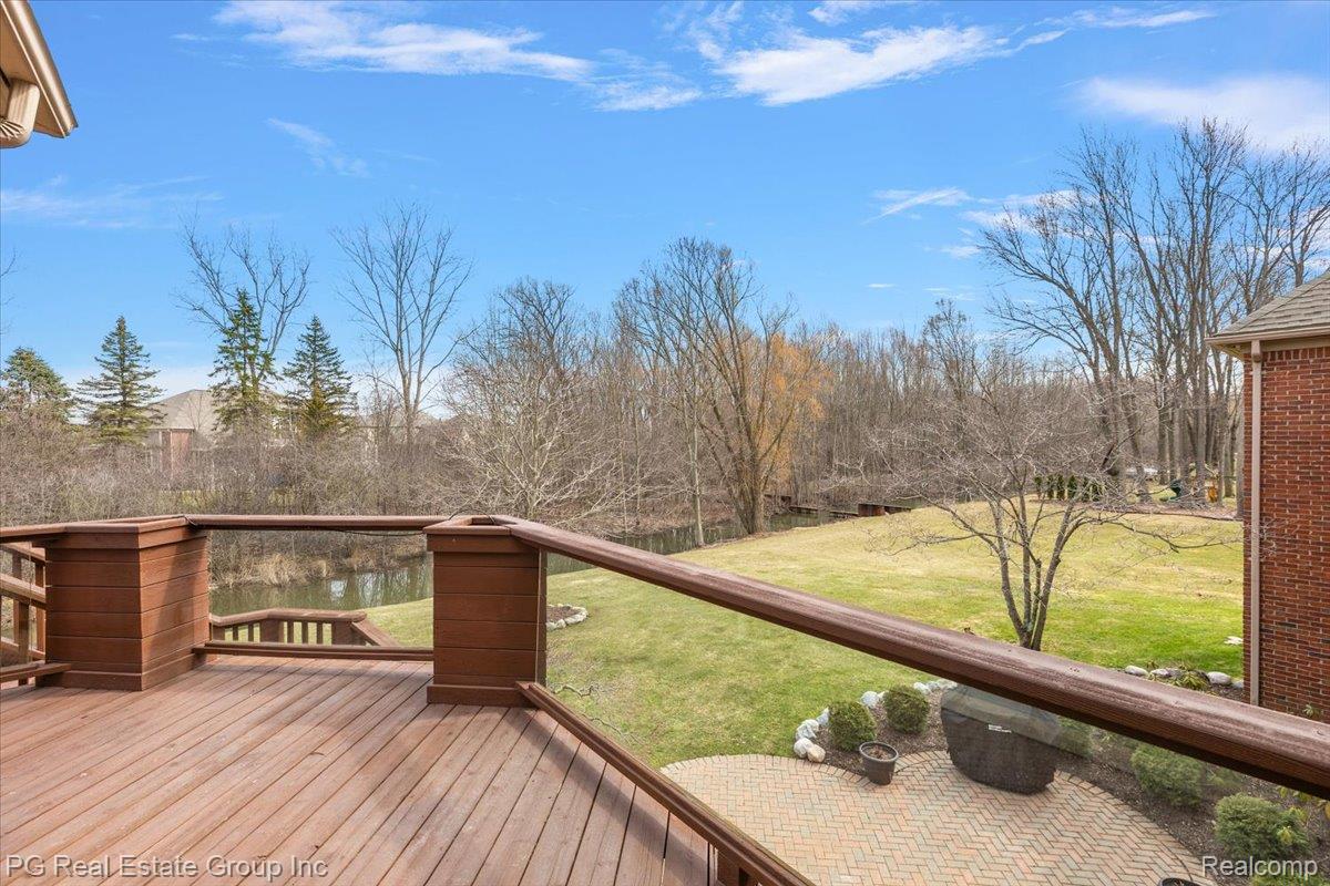 3571 Cedar Brook Drive Rochester, MI 48309 - Photo 9 of 57 Wooden terrace with a lawn
