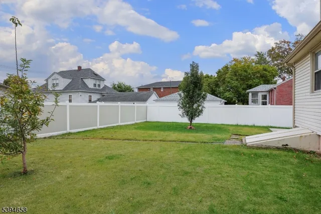 a view of a backyard with a garden and plants