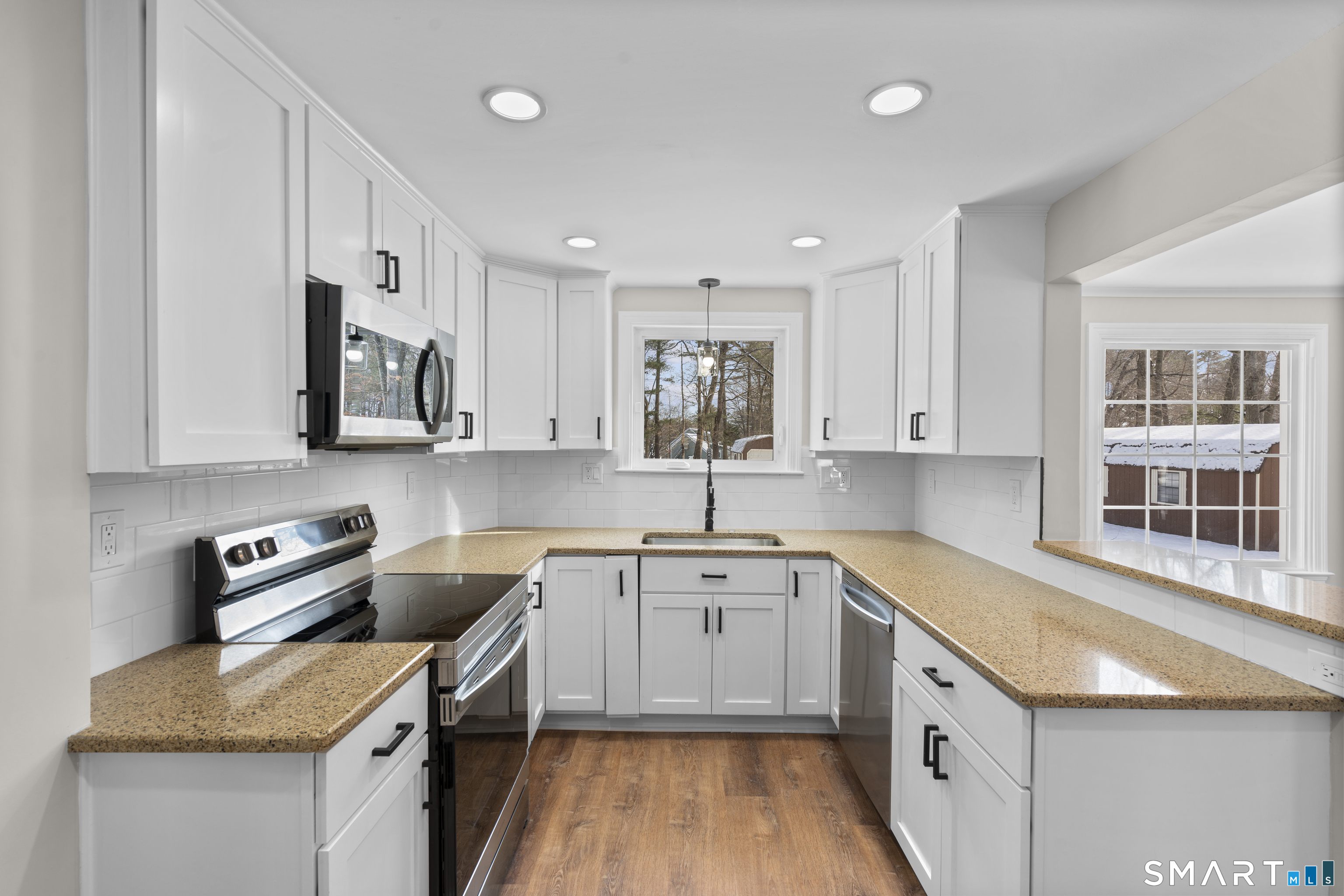 608 Kennedy Road Windsor, CT 06095 - Photo 13 of 39 a kitchen that has a sink and a stove in it