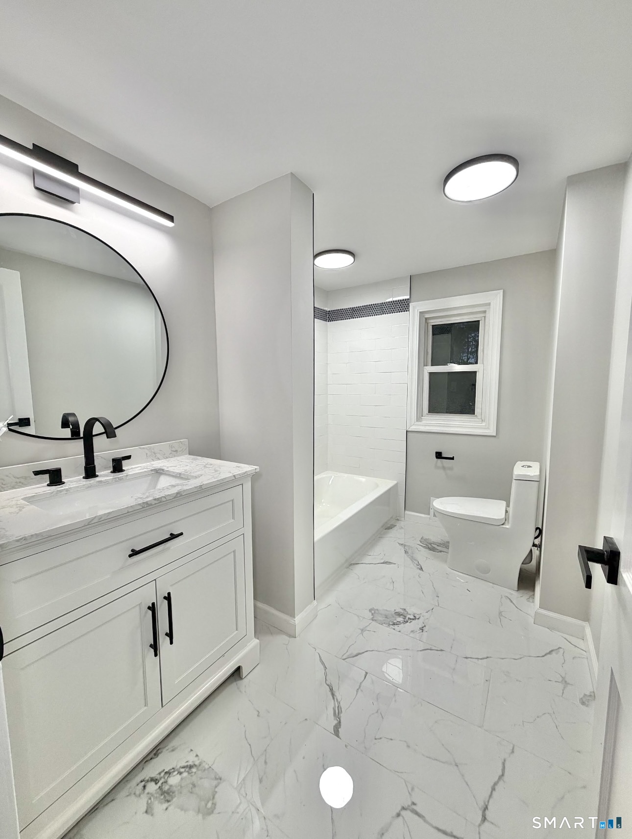 608 Kennedy Road Windsor, CT 06095 - Photo 17 of 39 a spacious bathroom with a sink double vanity and a mirror