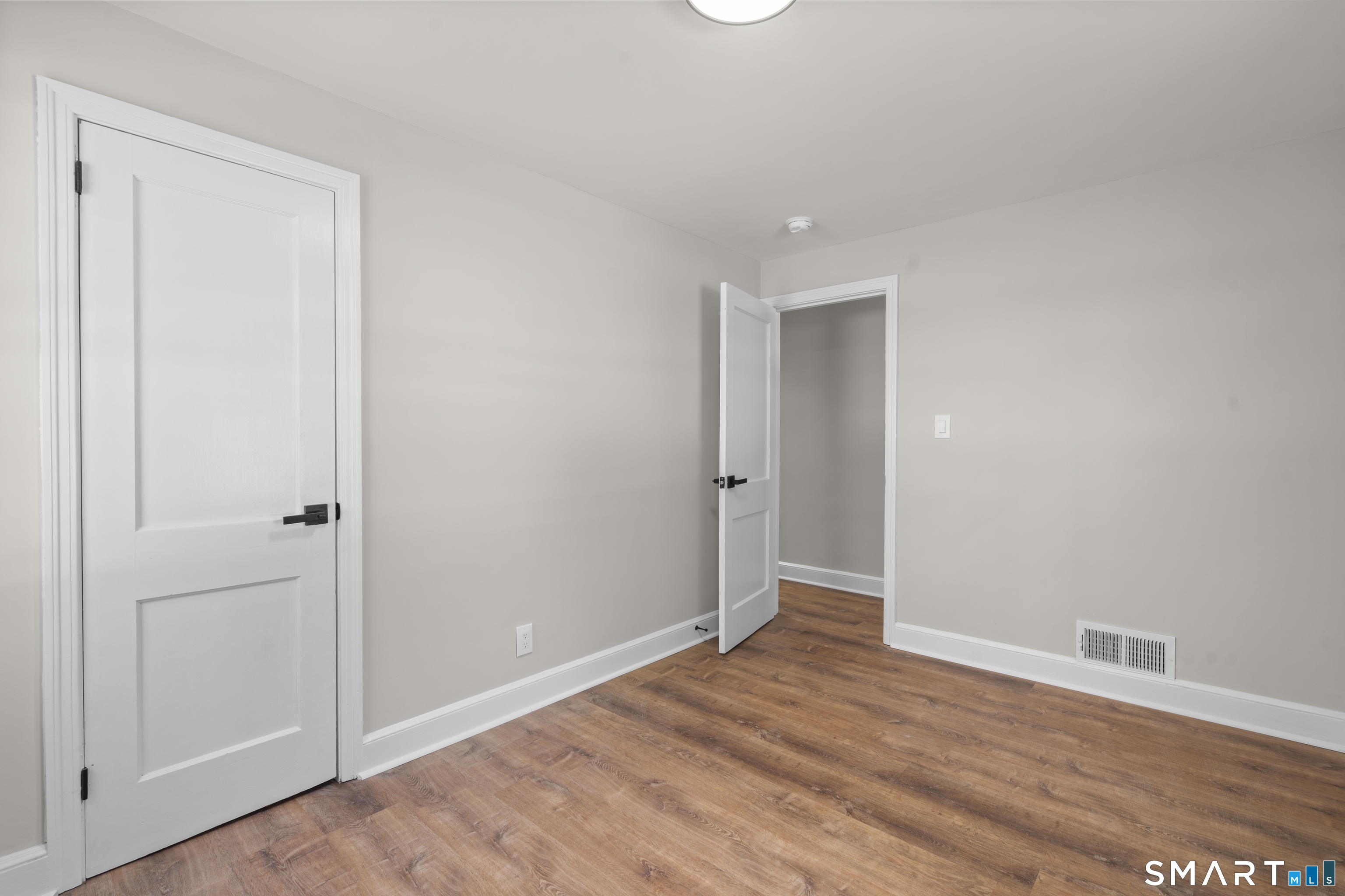 608 Kennedy Road Windsor, CT 06095 - Photo 23 of 39 a view of an empty room with wooden floor