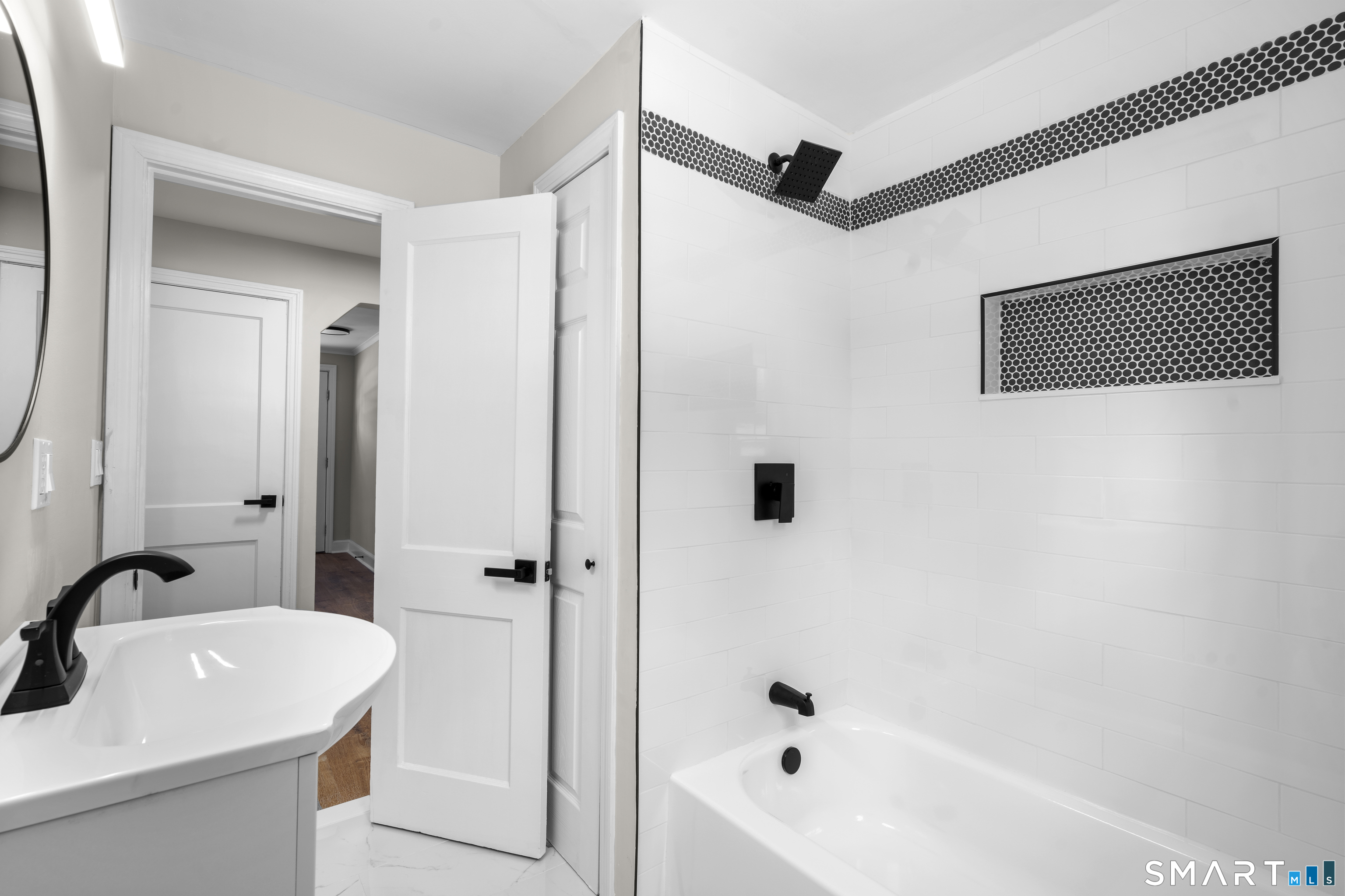 608 Kennedy Road Windsor, CT 06095 - Photo 25 of 39 a bathroom with a sink a shower and a mirror