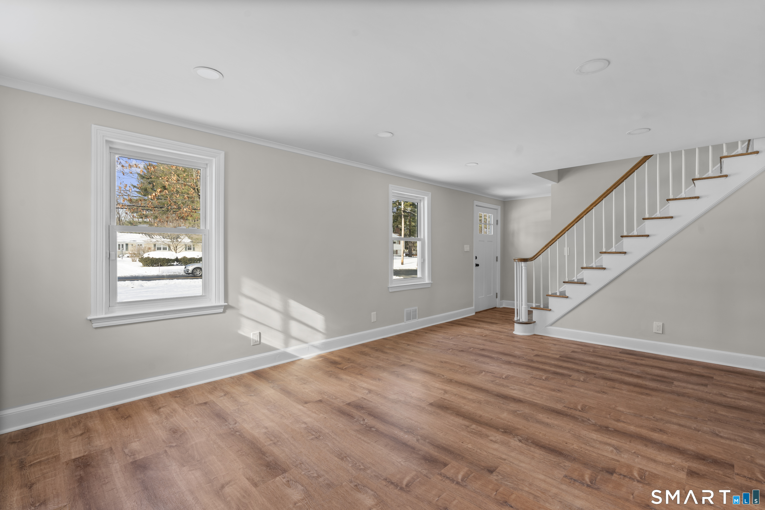 608 Kennedy Road Windsor, CT 06095 - Photo 7 of 39 a view of an empty room with wooden floor and a window
