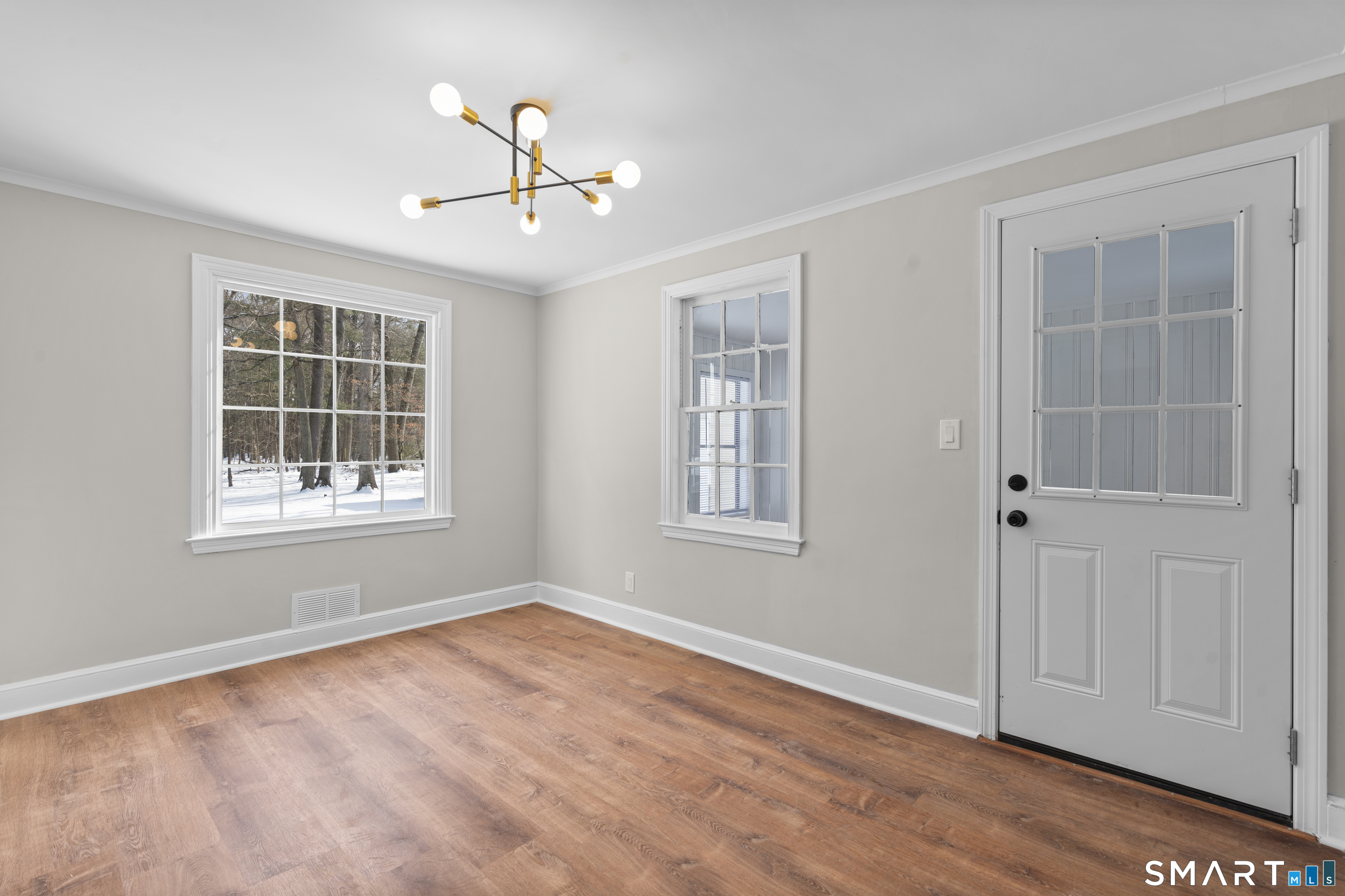 608 Kennedy Road Windsor, CT 06095 - Photo 10 of 39 a view of an empty room with a window and wooden floor