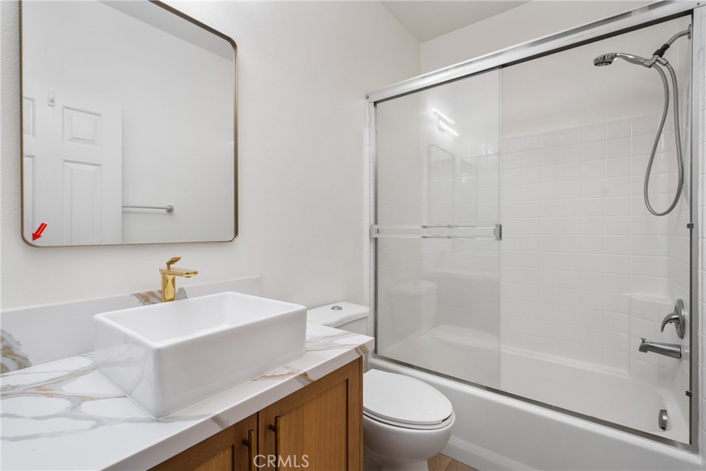 312 Quail Ridge Irvine, CA 92603 - Photo 13 of 20 a bathroom with a sink a toilet and shower