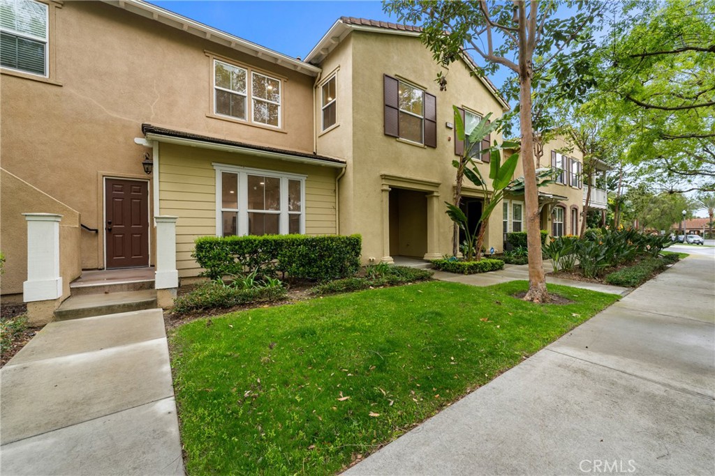312 Quail Ridge Irvine, CA 92603 - Photo 2 of 20 a front view of a house with a yard