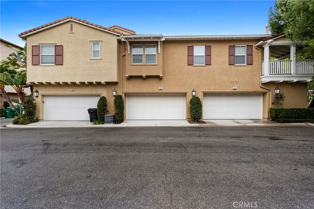 312 Quail Ridge Irvine, CA 92603 - Photo 3 of 20 a front view of a house with garage