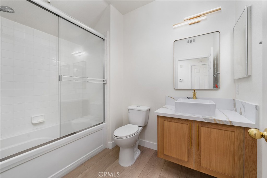 312 Quail Ridge Irvine, CA 92603 - Photo 5 of 20 a bathroom with a sink a toilet and shower