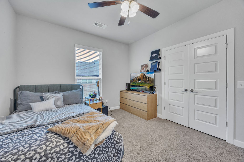 418 Casella Street Springdale, AR 72762 - Photo 24 of 34 Carpeted flooring with a ceiling fan, white paneled doors, and a window with blinds