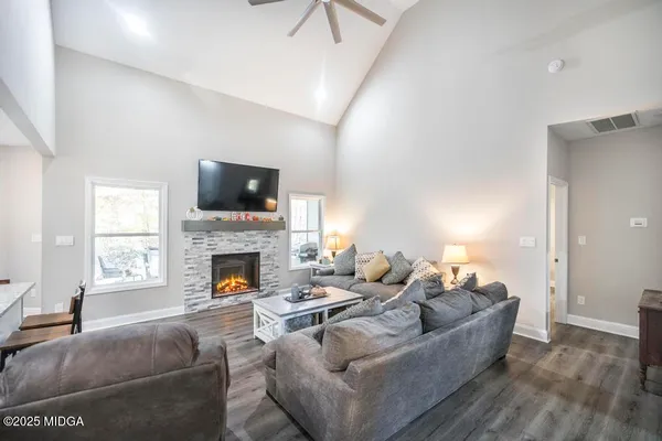 a spacious bedroom with a bed and a window