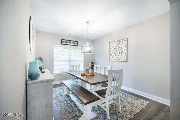 a living room with furniture window and a flat screen tv