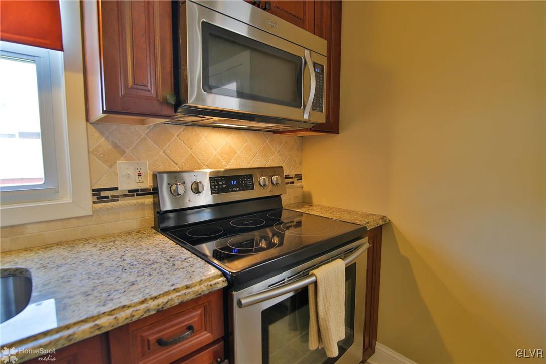 538 School Road Nazareth, PA 18064 - Photo 10 of 29 a kitchen with a stove and a microwave