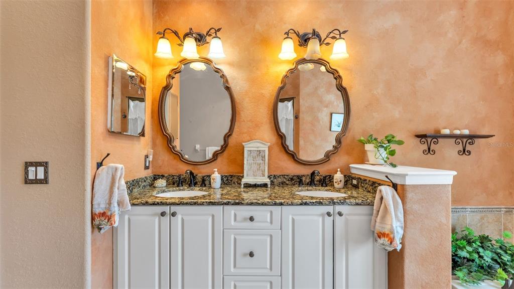 237 McLean Point Winter Haven, FL 33884 - Photo 20 of 85 a bathroom with double vanity sinks and a mirror