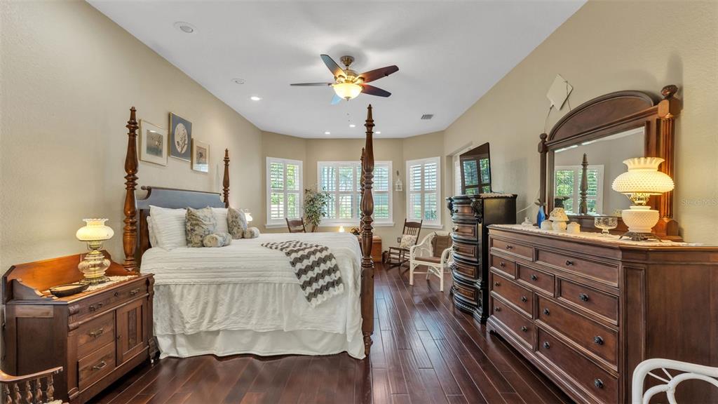 237 McLean Point Winter Haven, FL 33884 - Photo 26 of 85 a living room with furniture and wooden floor