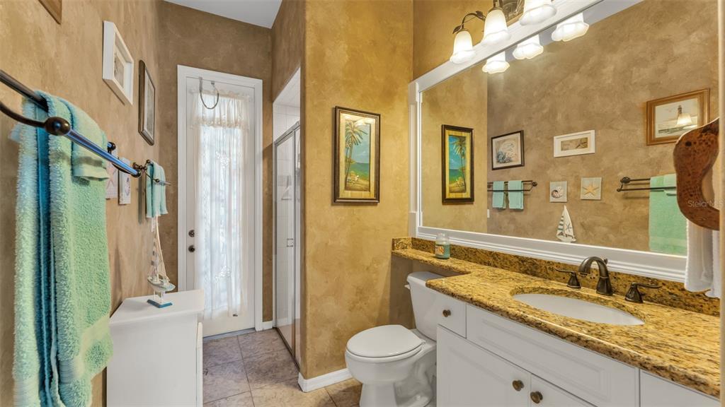 237 McLean Point Winter Haven, FL 33884 - Photo 29 of 85 a bathroom with a granite countertop sink toilet and shower