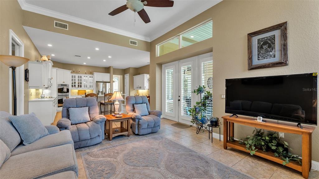 237 McLean Point Winter Haven, FL 33884 - Photo 35 of 85 a living room with furniture and a flat screen tv