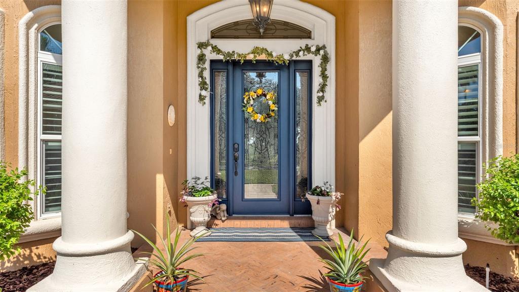237 McLean Point Winter Haven, FL 33884 - Photo 4 of 85 a front view of a house with outdoor seating
