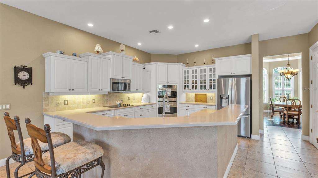 237 McLean Point Winter Haven, FL 33884 - Photo 43 of 85 a large kitchen with a large counter top appliances and cabinets