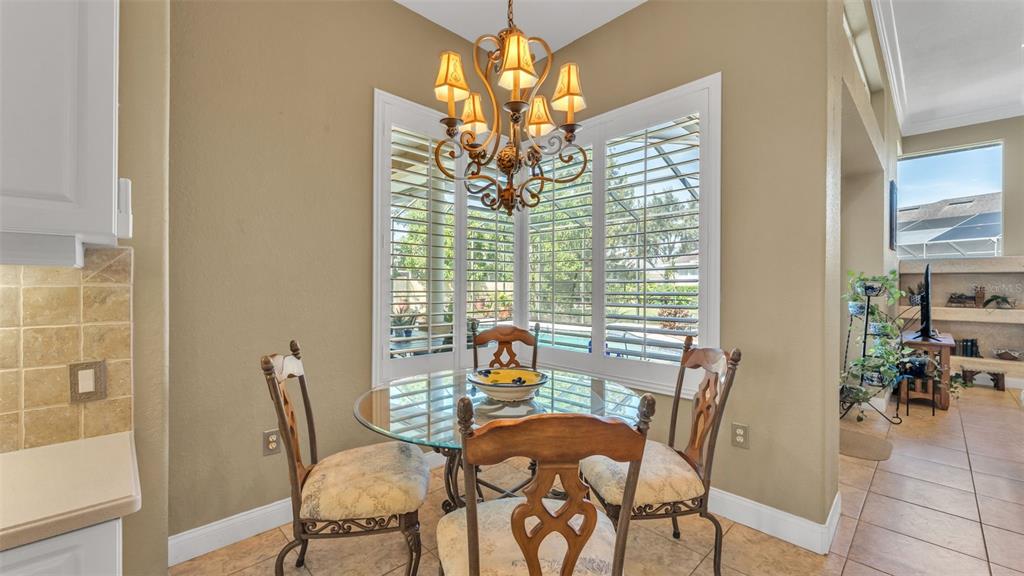 237 McLean Point Winter Haven, FL 33884 - Photo 44 of 85 a view of a dining room with furniture and chandelier
