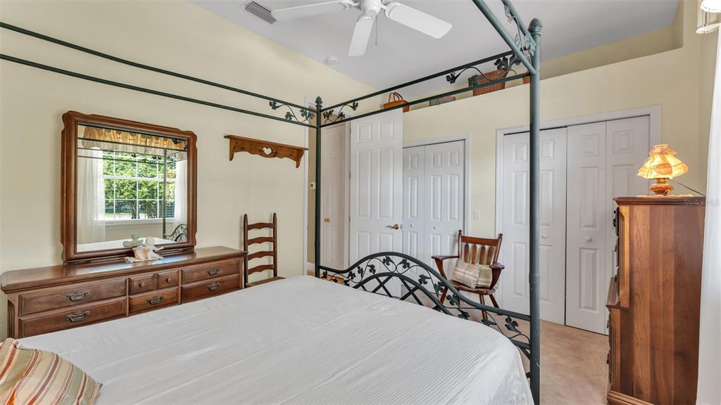 237 McLean Point Winter Haven, FL 33884 - Photo 51 of 85 a bedroom with a bed and a dresser