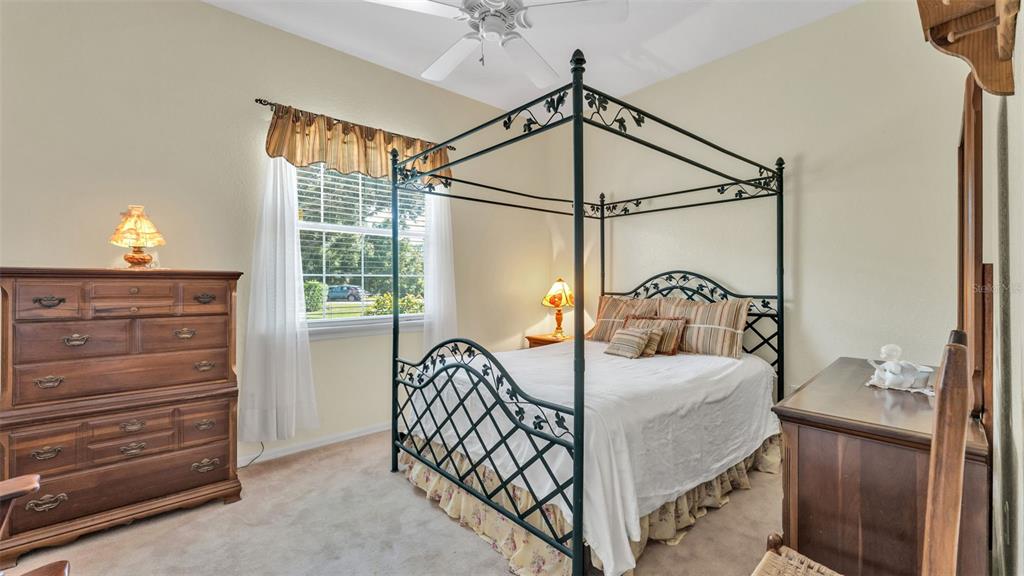 237 McLean Point Winter Haven, FL 33884 - Photo 52 of 85 a bedroom with a bed and a mirror