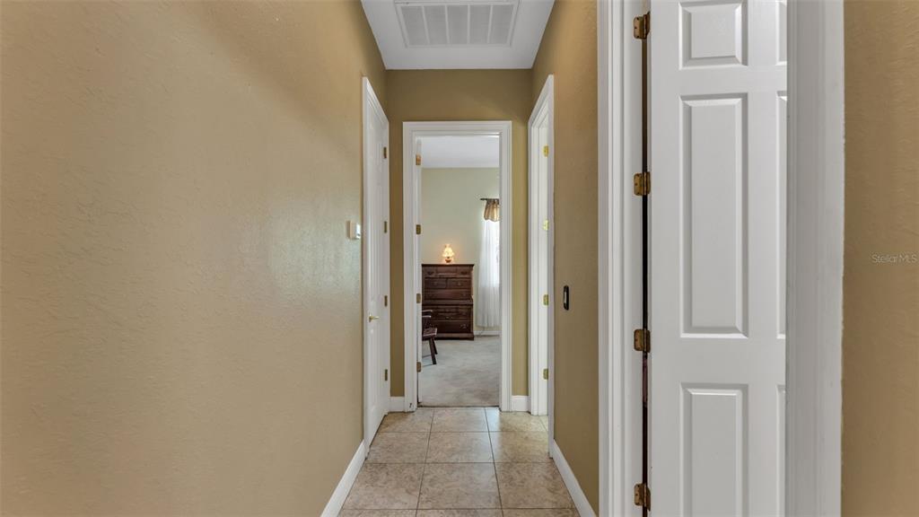 237 McLean Point Winter Haven, FL 33884 - Photo 54 of 85 a view of a hallway with wooden shelves