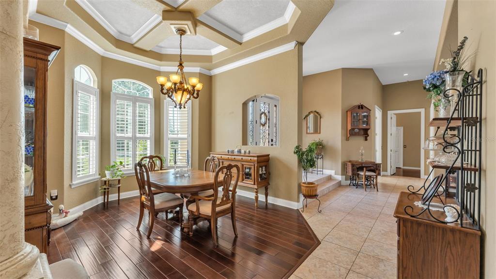 237 McLean Point Winter Haven, FL 33884 - Photo 55 of 85 a view of a a dining room with furniture window and wooden floor