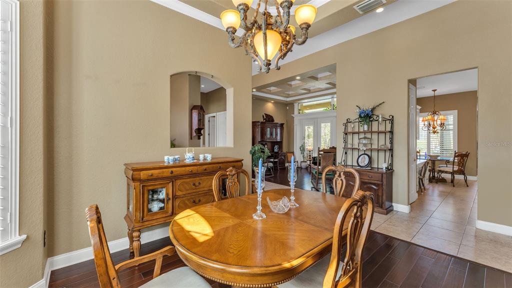 237 McLean Point Winter Haven, FL 33884 - Photo 56 of 85 a view of a dining room with furniture and wooden floor