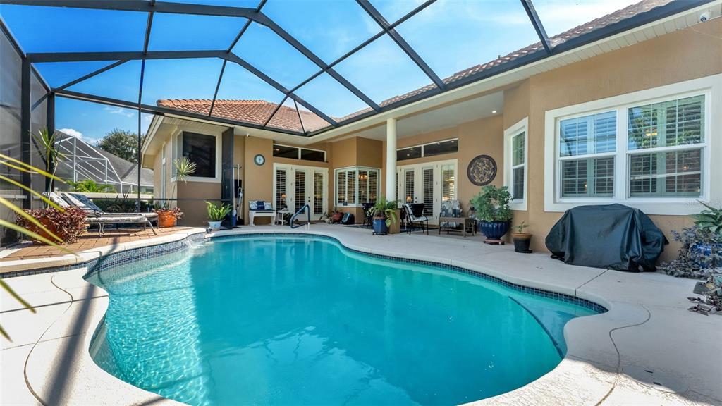 237 McLean Point Winter Haven, FL 33884 - Photo 6 of 85 a view of a patio with swimming pool table and chairs