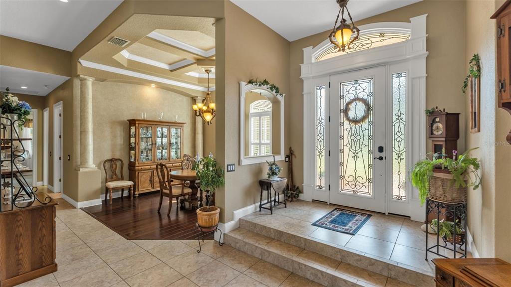237 McLean Point Winter Haven, FL 33884 - Photo 63 of 85 a living room with furniture and a chandelier