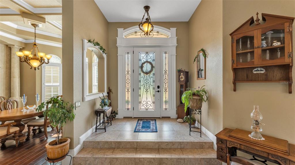 237 McLean Point Winter Haven, FL 33884 - Photo 64 of 85 a living room with furniture and a chandelier