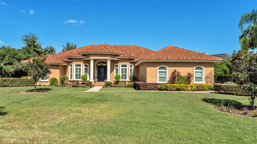237 McLean Point Winter Haven, FL 33884 - Photo 66 of 85 a front view of a house with swimming pool having outdoor seating