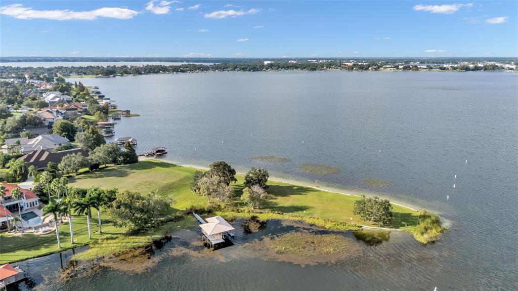 237 McLean Point Winter Haven, FL 33884 - Photo 68 of 85 a view of a lake with a city