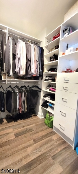 6 Elm Street, Unit 5 Madison, NJ 07940 - Photo 14 of 18 a view of walk in closet with clothes and shoes