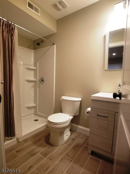6 Elm Street, Unit 5 Madison, NJ 07940 - Photo 18 of 18 a bathroom with a toilet and a shower