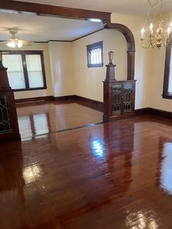 a view of an entryway with wooden floor