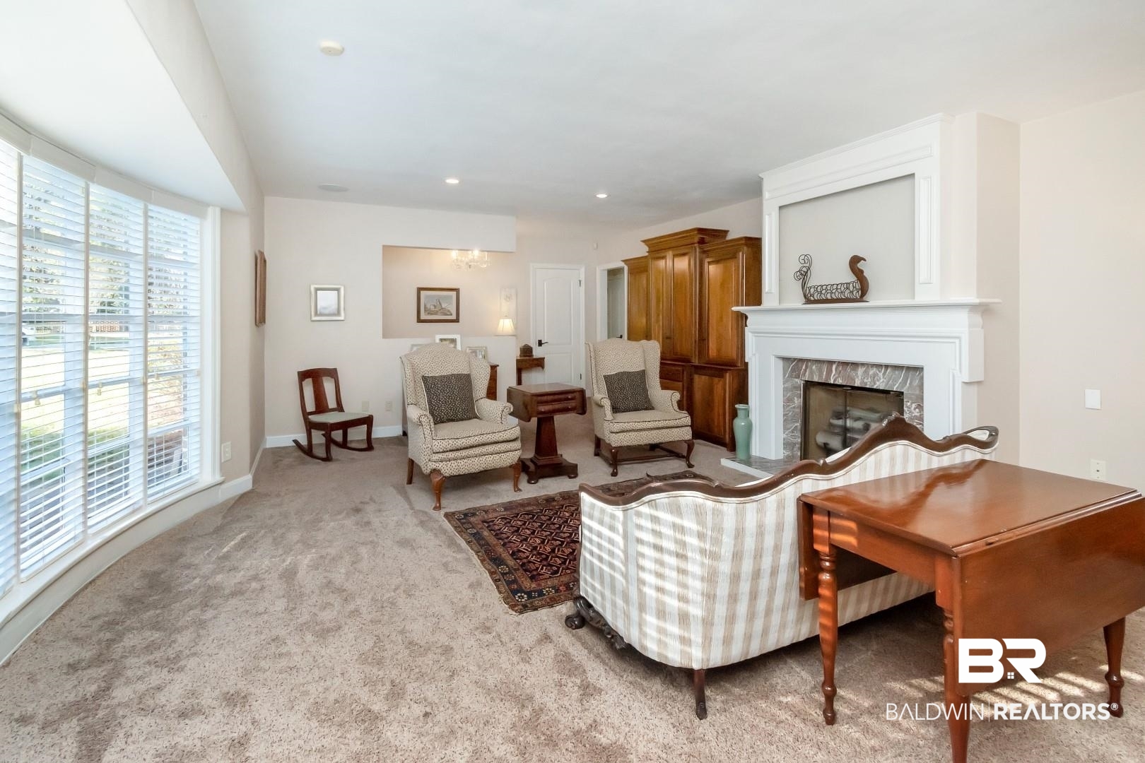 302 Springwood Drive East Mobile, AL 36608 - Photo 5 of 35 Living room featuring light carpet and a large fireplace