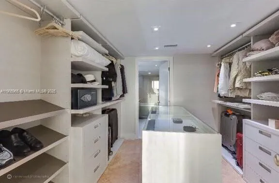 a kitchen with refrigerator and cabinets