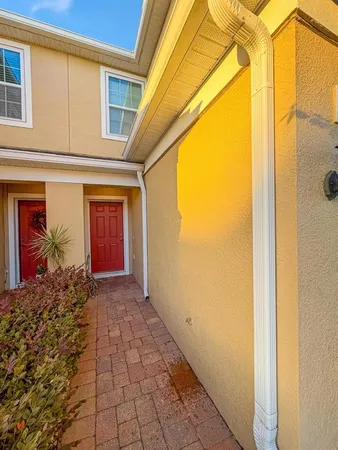 a view of a pathway along the house